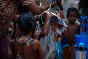 Children getting bathed.
