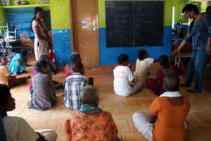 teaching the ladies to write their name