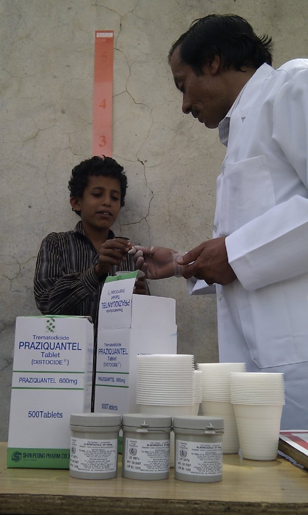 Young boy being measured and receiving treatment