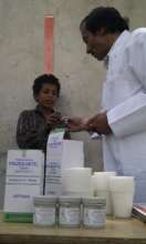 Young boy being measured and receiving treatment