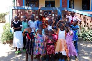 Vumilia's Rose Moon with program recipients