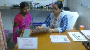 Sheila in consultation with doctor at Amrit Corner