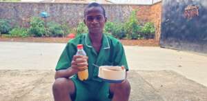 Alusine with his school lunch