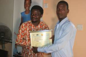 Ferenkeh received his certificate of completion