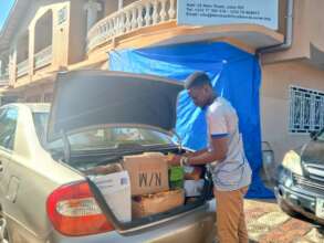 Joseph loading the car with school supplies