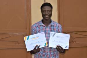 Mishael with his certificate