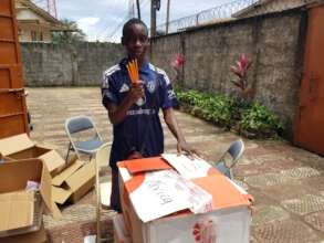 Edmond helping with the pencils
