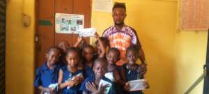 Abdulrahman with students at Kingtom Police School