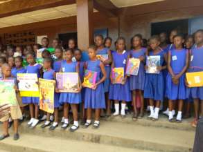 Outside the school - holding the books