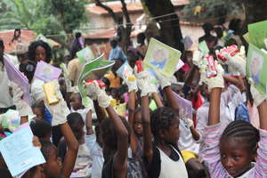 children happy to receive exercise books