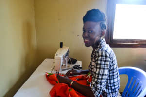 Sharifa in the Sewing Room at HALO.