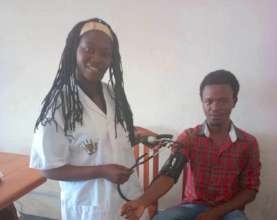 Claudine practices using her medical instruments