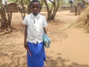 Maombi at home with her uniform and supplies