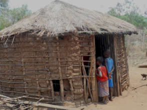 Girls looking inside Hekima's home