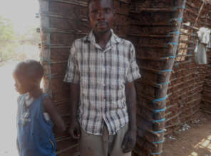 Hekima's father inside the family's home