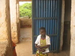 Nyota outside the school gates pre-enrollment
