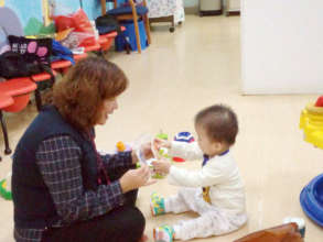 A toddler is undergoing therapy