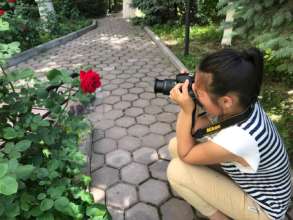Bermet was taking a photo of her favorite flower.