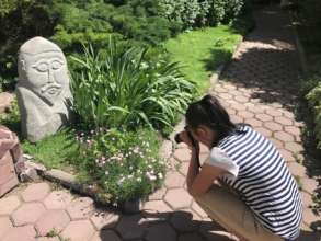 Bermet was photographing flowers.