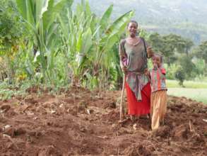 A woman and her daughter grow potatoes to sell