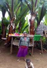 Nigist in front of her new home drying rack