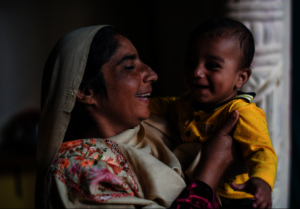 An independent and empowered Aasiya with her child