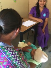 Nurse seeing patients with People for Guatemala