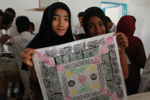 Excited trainees display a block-printed item