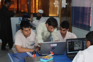 Trainer & trainees on computerized textile design