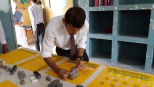Trainee completing his block printing assignment