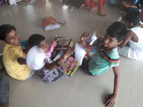 Kids displaying their "Paper fan" models