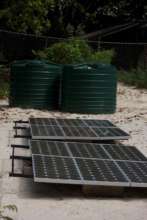 The solar panels and water tanks