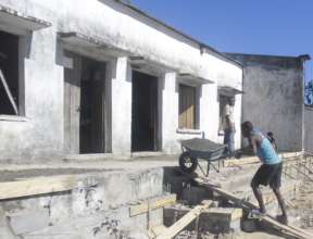 Transporting the heavy cement up onto the veranda