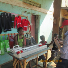 Mary on her Knitting machine and some the products