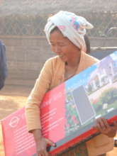 A community resident with her solar panel