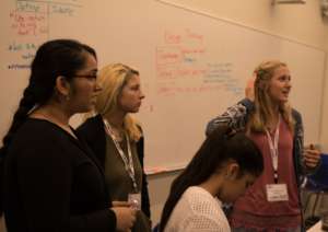 Young women collaborating to solve global problems