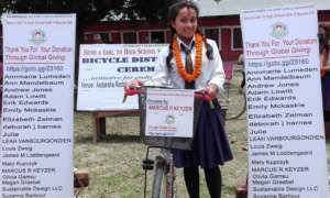 Shila 9th grader with her bicycle