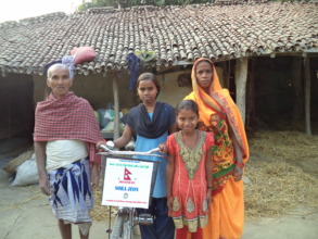 Sudhira in her family with the new bicycle