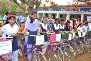 Girls after receiving a bicycle