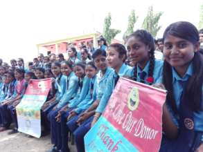 Girls acknowledging the bicycle donors