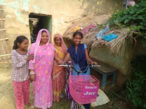 Nira with her family members at her home