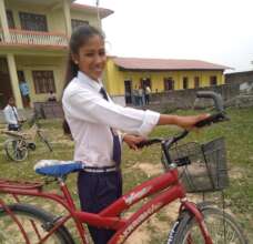 Kavita with her bicycle in 2017