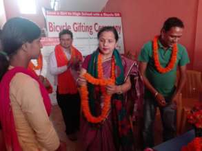 JWAS president felicitating a bicycle recipient