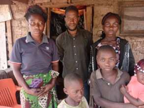Fatu (back right) with her family