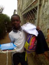 A child with his new school kit