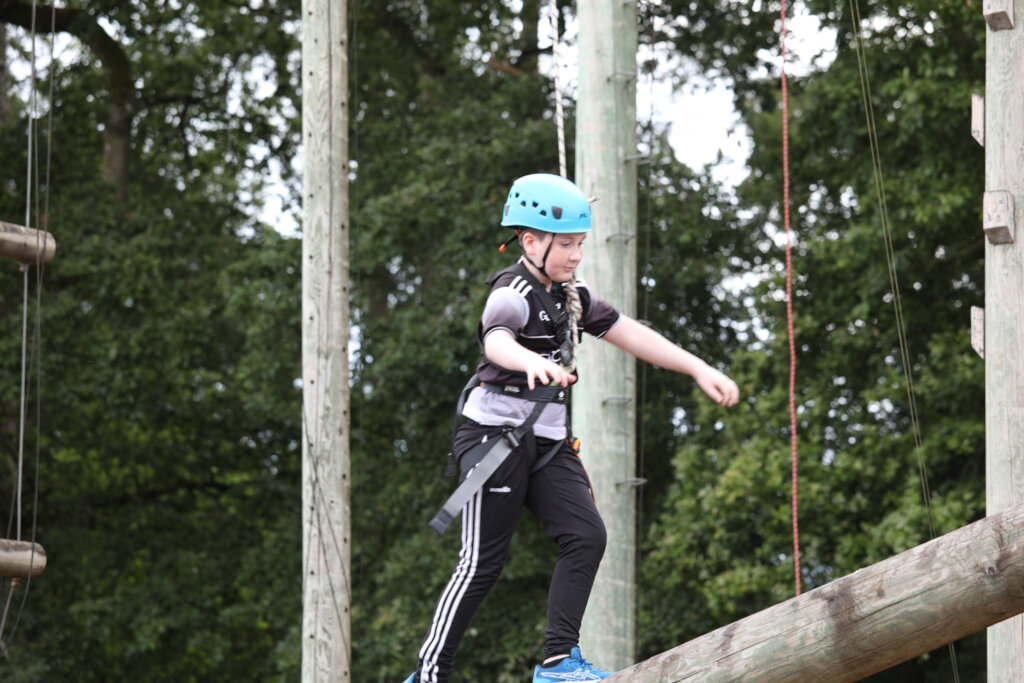 Walking the high ropes beam in Barretstown