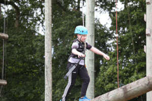 Walking the high ropes beam in Barretstown