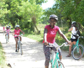 The Mariposa girls biking through their community