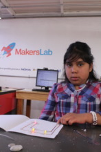 Paty with her paper circuit