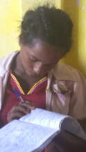 Ribka struggled to read her friend's handwriting